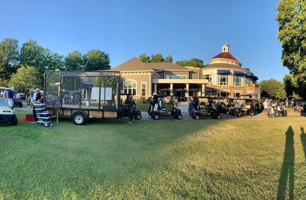 Mobile axe throwing setup at a Richmond country club event